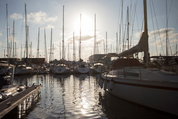 Fototapeta premium Boats Docked at the Sea Port. Boats Docked at the Yacht Club at sunset