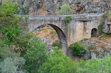 Fototapeta na wymiar Old bridge over Paiva river. Arouca, Portugal
