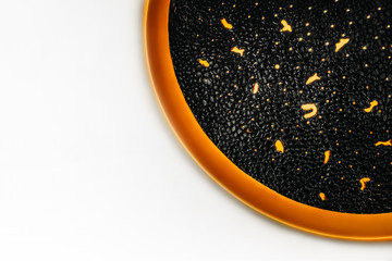 Circle wall moon lamp with moon texture and warm light. Copy space. Creative concept. Festive advertising flat lay banner. Halloween decor celebration. Trendy composition. Interior element.