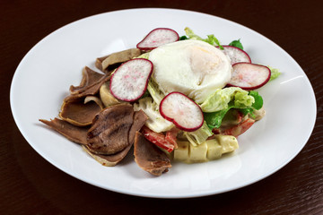salad with boiled tongue and poached egg