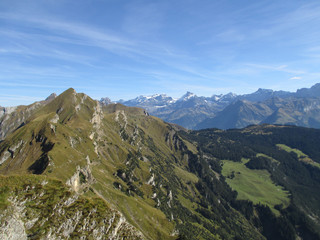 Fototapeta premium top of a mountain in the swiss alps with a mountain panorama in the background