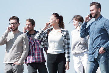 Fototapeta premium group of students talking on their smartphones.
