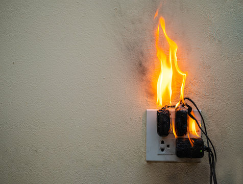 On fire adapter at plug Receptacle on white background