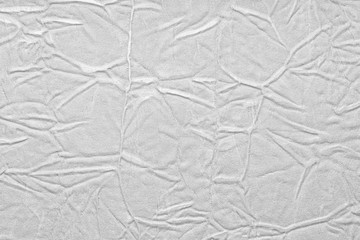 White crumpled leather texture. fabric with folds imitation under genuine leather. background. wallpaper