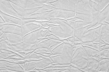 White crumpled leather texture. fabric with folds imitation under genuine leather. background. wallpaper