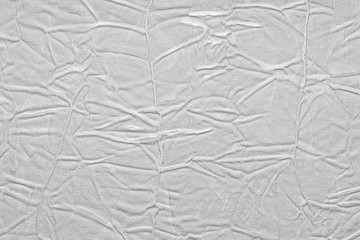 White crumpled leather texture. fabric with folds imitation under genuine leather. background. wallpaper