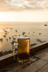 Glass of beer  with Sunset at Labuan Bajo, Flores, Indonesia