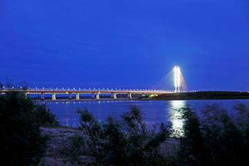 View of the Ob river and Yugorsky bridge at night in Western Siberia