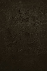 Urban concrete wall background with grooves and bubbles. Cement gray wall. Urban and industrialization art concept. Texture like concrete, stone, cement, plaster.. Poster mockup. Сloseup studio shot.