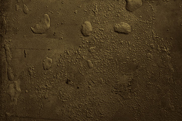 Urban concrete wall background with grooves and bubbles. Cement gray wall. Urban and industrialization art concept. Texture like concrete, stone, cement, plaster.. Poster mockup. Сloseup studio shot.