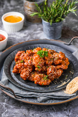 Karake chicken in homemade BBQ souce, topped with fresh microgreens in lighting studio