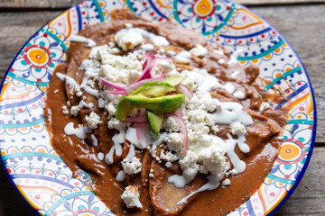 Mexican tacos with beans sauce and fresh cheese also called 