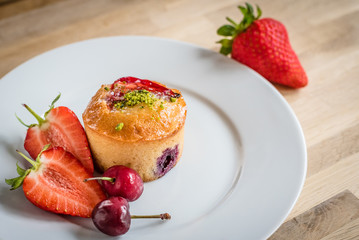 Glazed Fresh Fruit Cake on a White Plate