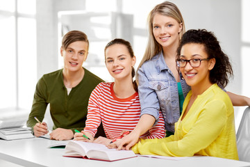 Fototapeta na wymiar education, learning and people concept - happy high school students or classmates with books and notebooks