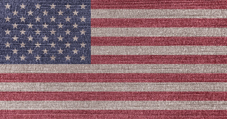 Grunge faded flag of USA. Isolated American banner on denim fabric. Rustic vintage style. U.S....