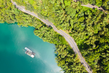 road in forest with a boat at Sun Moon Lake