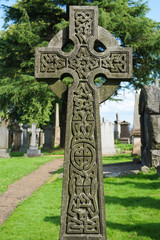 A large celtic cross on a Scottish cemetery