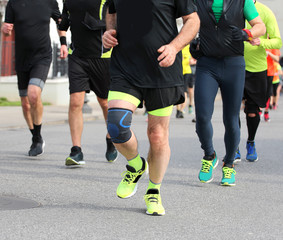 Fototapeta na wymiar athletes participating in a road marathon