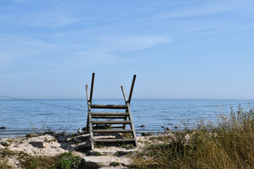 Wooden stile by a fence by the coast