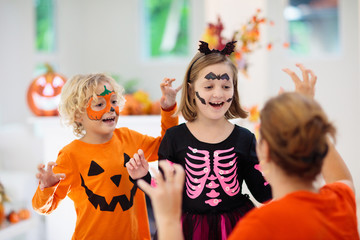 Child in Halloween costume. Kids trick or treat.