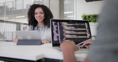 African American female student coding in class - Powered by Adobe