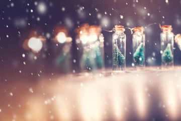 Close-up, Elegant Christmas tree in glass jar with snowflakes background. copy space.