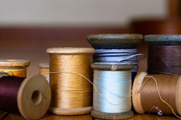 Fototapeta na wymiar Closeup of antique wooden thread spools