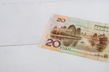 20 yuan on a white background. Chinese money on the table. Close-up.