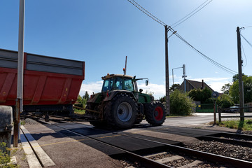 Fototapeta premium tractor at level crossing in Seine et Marne country