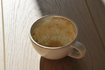 empty cup of coffee on wooden table