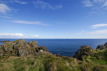 Fototapeta na wymiar View over the Atlantic ocean from Lagavulin bay on Islay