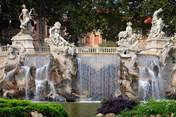 fountain with marble statues in turin in italy 