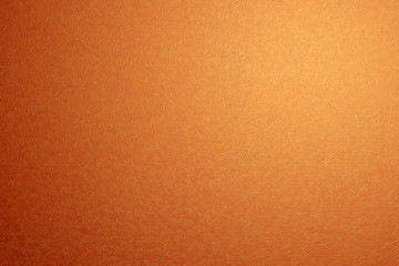 Texture. Bright orange color with light, yellow, rounded particles.