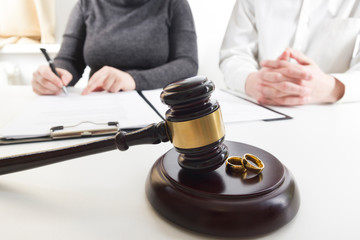 Divorce concept. Hands of wife, husband signing decree of divorce, canceling marriage, legal...