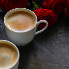 coffee in a white cup, bouquet red roses (gift, date or congratulation) menu concept. food background. copy space. Top view
