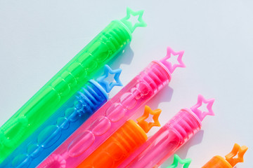 colorful stars on the lids of soap bubbles. background for holidays.