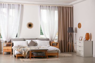 Stylish modern room interior with comfortable bed