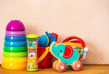 Kids toys on pink background
