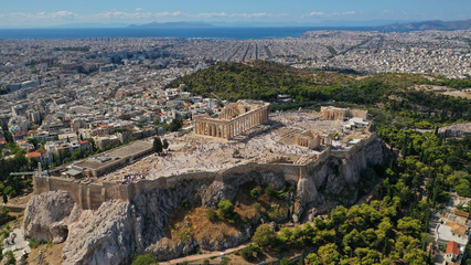 Fototapeta na wymiar Aerial drone panoramic photo of iconic Acropolis hill featuring masterpiece of Ancient times the Parthenon, Athens historic centre, Attica, Greece