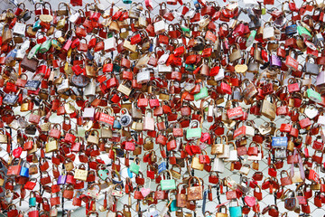 Closeup of love lockers at famous bridge Makartsteg in Salzburg, Austria. Padlocks of love on a bridge