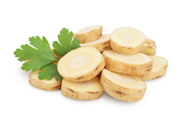Parsnip root slices with parsley isolated on white background closeup