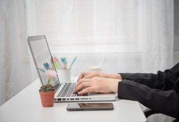 woman using laptop in office