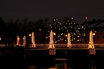 Christmas bridge lanterns glowing in the dark