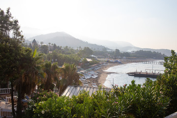 Sunny Alanya beach in Turkey with sea view. Konakli old town View from the fortress on the mountain. Mediterranean Sea
