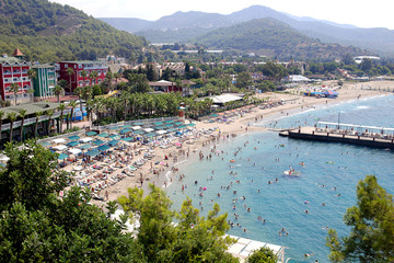 Sunny Alanya beach in Turkey with sea view. Konakli old town View from the fortress on the mountain. Mediterranean Sea