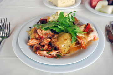 Lamb dish with stuffed peppers in blue cheese sauce.