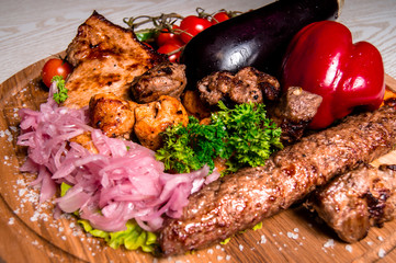 meat plate with vegetables and herbs