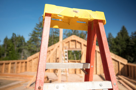 Ladder at a new home construction site, building concept image