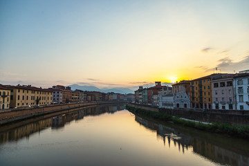 Fototapeta na wymiar Embankment of the River Arno in the Italian City of Pisa.