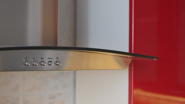 The Man Pressed Button On Panel Contemporary Kitchen Hood.